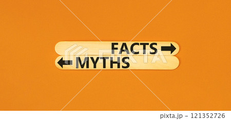 Facts or myths symbol. Concept word Myths and Facts on beautiful wooden stick. Beautiful orange table orange background. Business and facts or myths fact myth concept. Copy space. Facts or myths symbol. Concept word Myths and Facts on beautiful wooden stick. Beautiful orange table orange background. Business and facts or myths fact myth concept. Copy space. 121352726