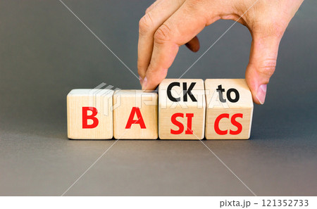 Back to basics symbol. Concept words Back to basics on wooden block. Beautiful grey table grey background. Businessman hand. Business back to basics concept. Copy space. 121352733