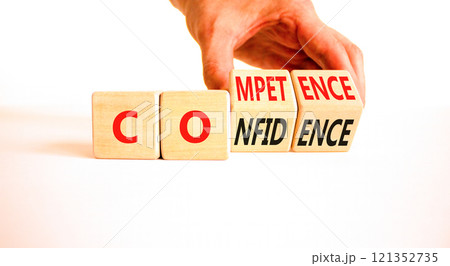 Competence and confidence symbol. Concept word Competence Confidence on wooden cubes. Businessman hand. Beautiful white table white background. Business competence confidence concept. Copy space. 121352735