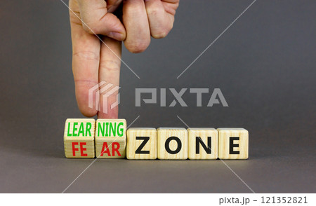 Learning or fear zone symbol. Concept words Learning zone Fear zone on wooden cubes. Beautiful grey table grey background. Psychologist hand. Business and learning or fear zone concept. Copy space. Learning or fear zone symbol. Concept words Learning zone Fear zone on wooden cubes. Beautiful grey table grey background. Psychologist hand. Business and learning or fear zone concept. Copy space. 121352821