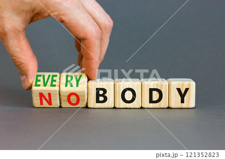 Everybody vs nobody symbol. Concept words Everybody and Nobody on wooden cubes. Beautiful grey table grey background. Businessman hand. Business and everybody vs nobody concept. Copy space. Everybody vs nobody symbol. Concept words Everybody and Nobody on wooden cubes. Beautiful grey table grey background. Businessman hand. Business and everybody vs nobody concept. Copy space. 121352823