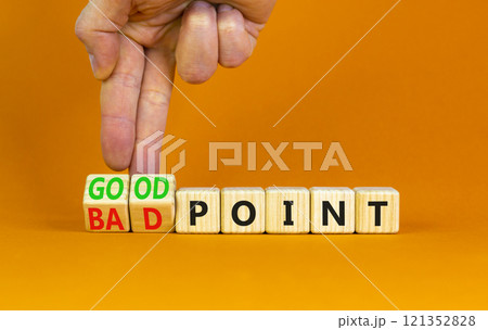 Good or bad point symbol. Concept words Good point Bad point on beautiful wooden blocks. Beautiful orange table orange background. Businessman hand. Business good bad point concept. Copy space 121352828