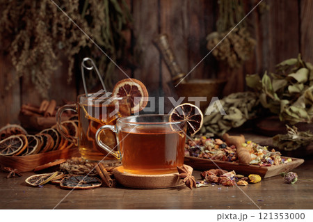 Cups of herbal tea with various dried herbs, flowers, and spices. Cups of herbal tea with various dried herbs, flowers, and spices. 121353000