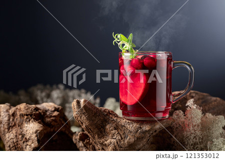 Hot drink with cranberries, lime, and rosemary. Hot drink with cranberries, lime, and rosemary. 121353012