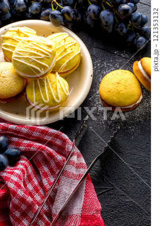 Homemade round lemon cookies. French sweet yellow cookies macarons. 121353132
