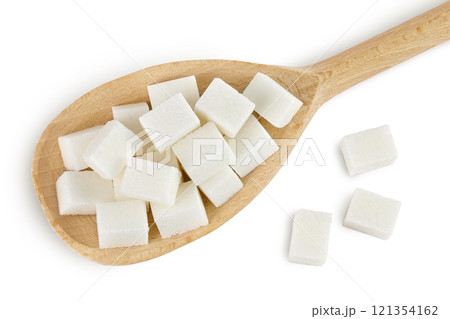 Sugar cubes in a wooden spoon isolated on white background. Top view. Flat lay Sugar cubes in a wooden spoon isolated on white background. Top view. Flat lay 121354162