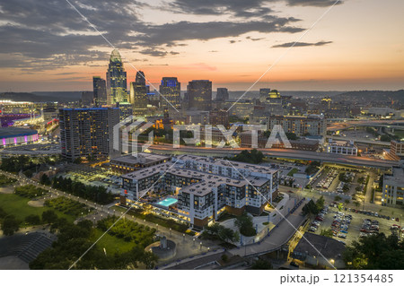 Cincinnati Ohio USA night urban landscape. Downtown district skyline with brightly illuminated high skyscraper buildings in modern American megapolis Cincinnati Ohio USA night urban landscape. Downtown district skyline with brightly illuminated high skyscraper buildings in modern American megapolis 121354485
