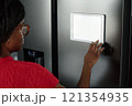 High angle shot of unrecognizable housewife installing app for smart home to control refrigerator 121354935