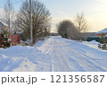 Snowy European village road on a sunny day in December. High quality photo 121356587