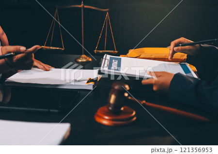 Judge gavel with Justice lawyers having team meeting at law firm background. Concepts of Law and Legal services. Judge gavel with Justice lawyers having team meeting at law firm background. Concepts of Law and Legal services. 121356953