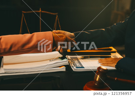 Judge gavel with Justice lawyers having team meeting at law firm background. Concepts of Law and Legal services. Judge gavel with Justice lawyers having team meeting at law firm background. Concepts of Law and Legal services. 121356957