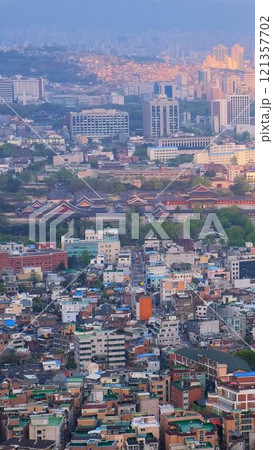 Aerial view of Seoul downtown cityscape with Gyeongbokgung Palace on sunset from Inwang mountain. Seoul, South Korea. Aerial view of Seoul downtown cityscape with Gyeongbokgung Palace on sunset from Inwang mountain. Seoul, South Korea. 121357702