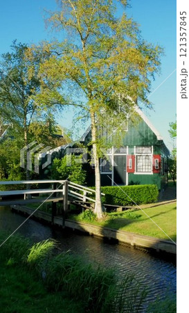 Traditional old country farm house in the museum village of Zaanse Schans, Netherlands Traditional old country farm house in the museum village of Zaanse Schans, Netherlands 121357845