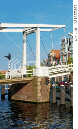 Spaarne river with Gravestenenbrug bridge. Harlem, Netherlands 121357863