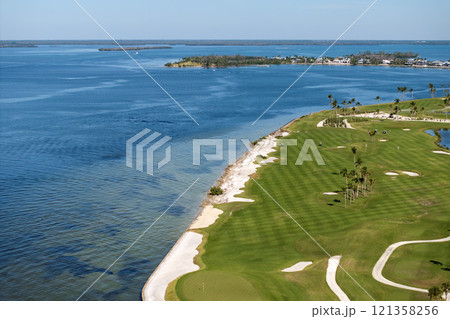 Big golf course field with green grass in Boca Grande, small town on Gasparilla Island in southwest Florida Big golf course field with green grass in Boca Grande, small town on Gasparilla Island in southwest Florida 121358256