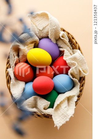 Happy Easer eggs in a basket Happy Easer eggs in a basket 121358437