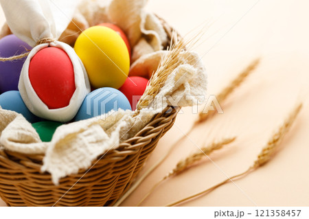 Happy Easer eggs in a basket 121358457