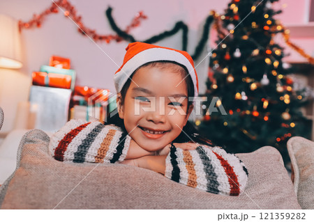 christmas, x-mas, winter, happiness concept - dreaming girl in santa helper hat christmas, x-mas, winter, happiness concept - dreaming girl in santa helper hat 121359282