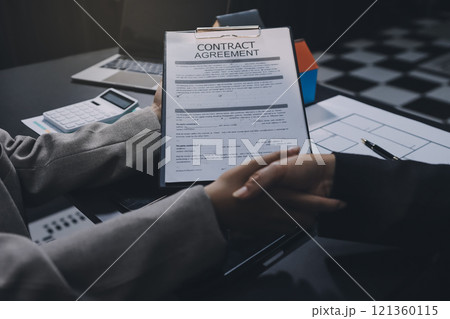 Close up Business people or Real Estate agent explain signing agreement for sale house to client. Property, Insurance, Broker concept. 121360115