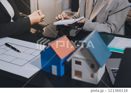Close up Business people or Real Estate agent explain signing agreement for sale house to client. Property, Insurance, Broker concept. 121360116