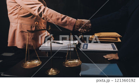 Judge gavel with Justice lawyers having team meeting at law firm background. Concepts of Law and Legal services. 121360192