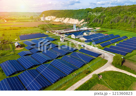 Aerial view of electrical power plant with rows of solar photovoltaic panels for producing clean ecological electric energy at industrial area. Renewable electricity with zero emission concept. 121360823