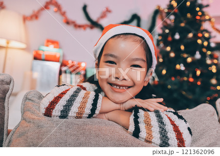 christmas, x-mas, winter, happiness concept - dreaming girl in santa helper hat christmas, x-mas, winter, happiness concept - dreaming girl in santa helper hat 121362096