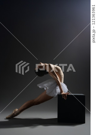 Dynamic ballet dancer showcasing elegant movements in studio setting Dynamic ballet dancer showcasing elegant movements in studio setting 121363961