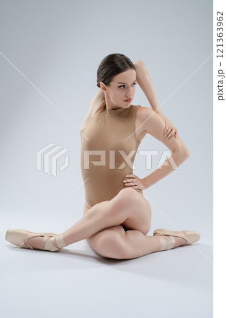 Ballet dancer in graceful pose showcasing flexibility and strength Ballet dancer in graceful pose showcasing flexibility and strength 121363962
