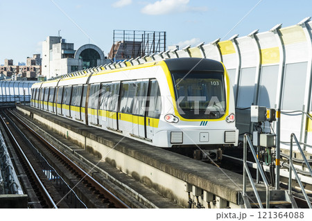 A train traveling on the Circular Line (Yellow Line) metro in New Taipei City, Taiwan, The metro with driverless technology. A train traveling on the Circular Line (Yellow Line) metro in New Taipei City, Taiwan, The metro with driverless technology. 121364088