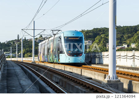 A train traveling on the Danhai Light Rail transit (LRT) in New Taipei City, Taiwan. 121364094