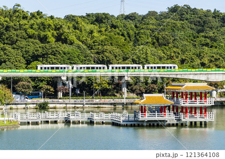 A train traveling on the Wenhu or Brown Line of the Taipei MRT, Taiwan, passes by Taipei Dahu Park. A train traveling on the Wenhu or Brown Line of the Taipei MRT, Taiwan, passes by Taipei Dahu Park. 121364108