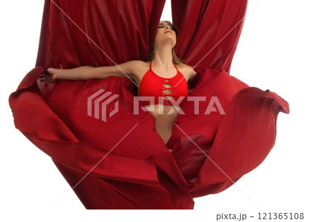 Barefoot lady dancing with fabric 121365108