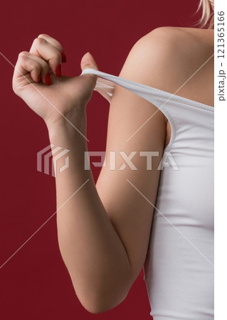 Sexy blonde in unbuttoned jeans and top view 121365166