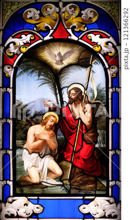 Baptism of the Lord, stained glass window in the Church of St. Ambrose and Theodulus, Stresa, Lago Maggiore, Piedmont, Italy 121366292