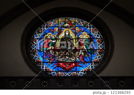 Virgin Mary surrounded by Angels by Lorenzo Ghiberti, 1405, stained glass window in the Cattedrale di Santa Maria del Fiore (Cathedral of Saint Mary of the Flower), Florence, Italy 121366293