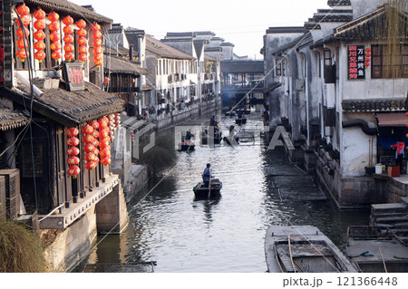 Tourist boats on the water canals of Xitang Town in Zhejiang Province, China Tourist boats on the water canals of Xitang Town in Zhejiang Province, China 121366448