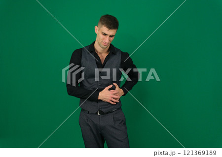Young man with stomach pain on white background Young man with stomach pain on white background 121369189