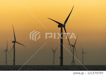 Sunset view of the Offshore wind power systems off the western coast of Taiwan. Sunset view of the Offshore wind power systems off the western coast of Taiwan. 121370797