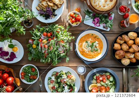 Culinary scenes featuring diverse and inclusive food cultures, including vegan and vegetarian meals, allergy-friendly dishes, and traditional foods from around the world 121372604