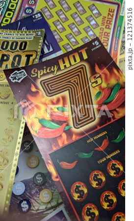 Scratch-off lottery tickets at a table Scratch-off lottery tickets at a table 121374516