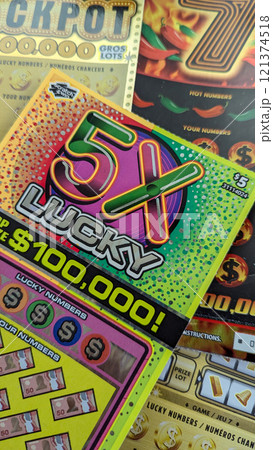 Scratch-off lottery tickets at a table 121374518