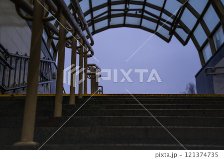 Exit from the underpass in the evening. Cloudy sky. Steps up 121374735