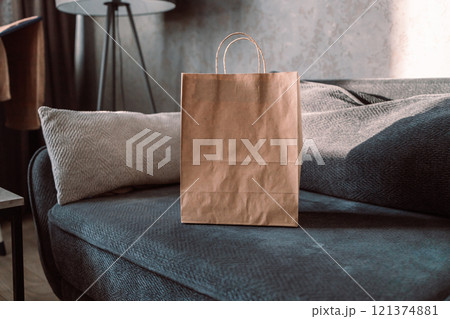 Shopping bag with boxes and shoes on sofa in room. Online business shopping concept.  121374881