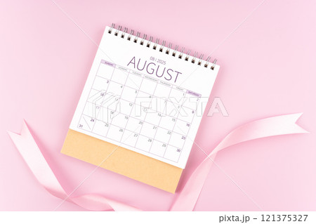 August 2025 desk calendar with pink pastel ribbon. August 2025 desk calendar with pink pastel ribbon. 121375327