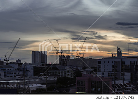 Silhouette view of Construction of tall buildings with a crane and background of Dramatic sky in the city of Bangkok. 121376742