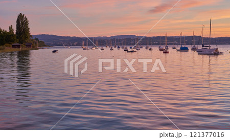 Bodensee Lake Sunset Panorama. Evening Sunlight Over Tranquil Waters. Sunset Vista at Lake Bodensee in Germany. 121377016