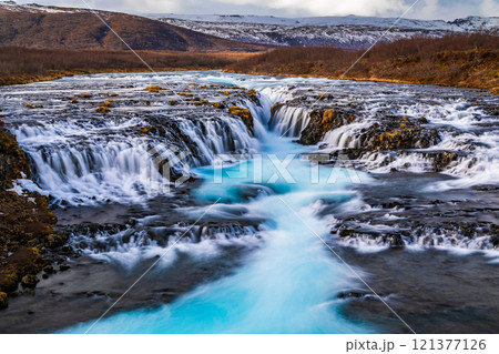 Beautiful turquoise Bruarfoss Waterfall in the autumn, Iceland Beautiful turquoise Bruarfoss Waterfall in the autumn, Iceland 121377126