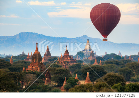 Balloon over plain of Bagan in misty morning, Myanmar 121377129