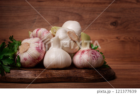 Fresh young garlic, white and purple color, on a wooden table, no people, Fresh young garlic, white and purple color, on a wooden table, no people, 121377639